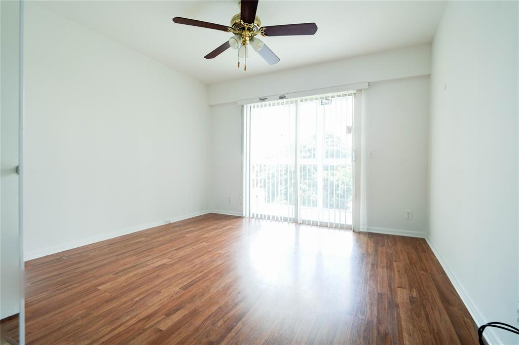 300 Southwest 134th Way, Unit 402E Pembroke Pines, FL 33027 - Photo 19 of 46 a view of an empty room with wooden floor and a window
