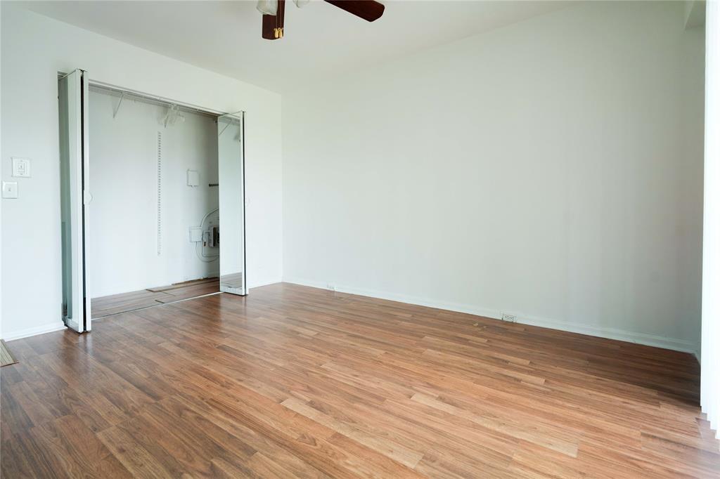 300 Southwest 134th Way, Unit 402E Pembroke Pines, FL 33027 - Photo 20 of 46 a view of an empty room with wooden floor
