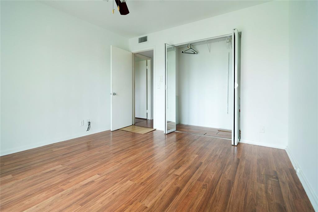 300 Southwest 134th Way, Unit 402E Pembroke Pines, FL 33027 - Photo 21 of 46 an empty room with wooden floor and windows