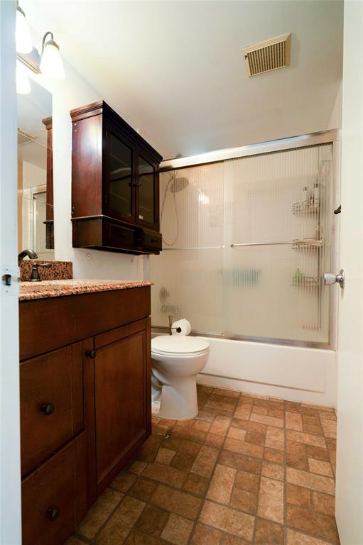 300 Southwest 134th Way, Unit 402E Pembroke Pines, FL 33027 - Photo 23 of 46 a bathroom with a sink a toilet and mirror