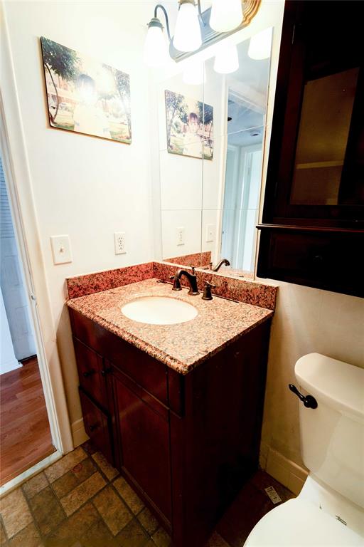 300 Southwest 134th Way, Unit 402E Pembroke Pines, FL 33027 - Photo 24 of 46 a bathroom with a granite countertop sink and a toilet