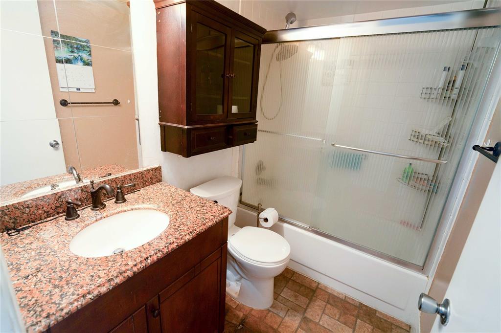 300 Southwest 134th Way, Unit 402E Pembroke Pines, FL 33027 - Photo 25 of 46 a bathroom with a granite countertop sink toilet and shower