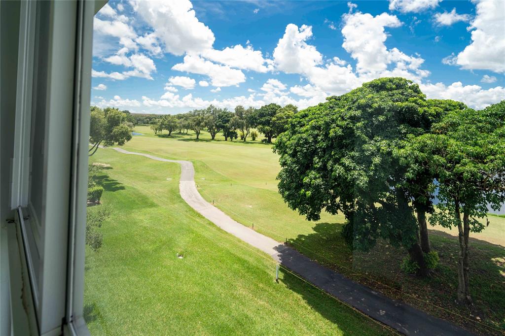 300 Southwest 134th Way, Unit 402E Pembroke Pines, FL 33027 - Photo 30 of 46 a view of a yard with swimming pool