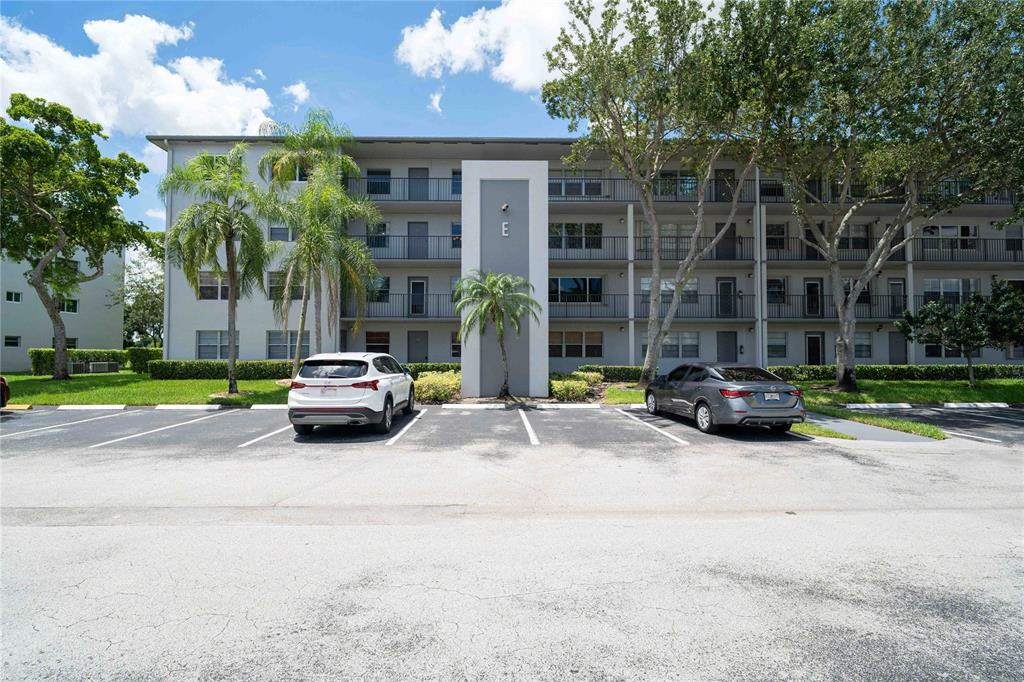 300 Southwest 134th Way, Unit 402E Pembroke Pines, FL 33027 - Photo 3 of 46 a view of street with parked cars