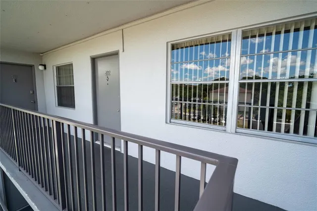 a view of a balcony with wooden floor