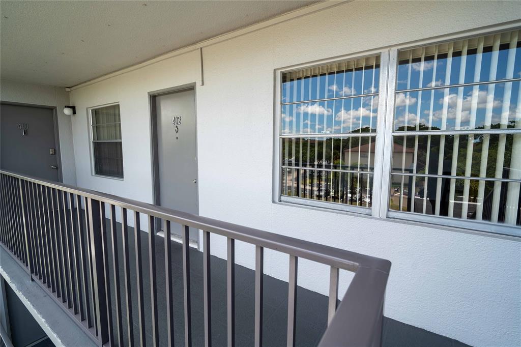 300 Southwest 134th Way, Unit 402E Pembroke Pines, FL 33027 - Photo 33 of 46 a view of a balcony from wooden floor
