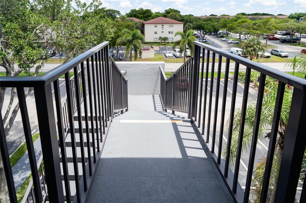 300 Southwest 134th Way, Unit 402E Pembroke Pines, FL 33027 - Photo 34 of 46 a view of a balcony with wooden floor
