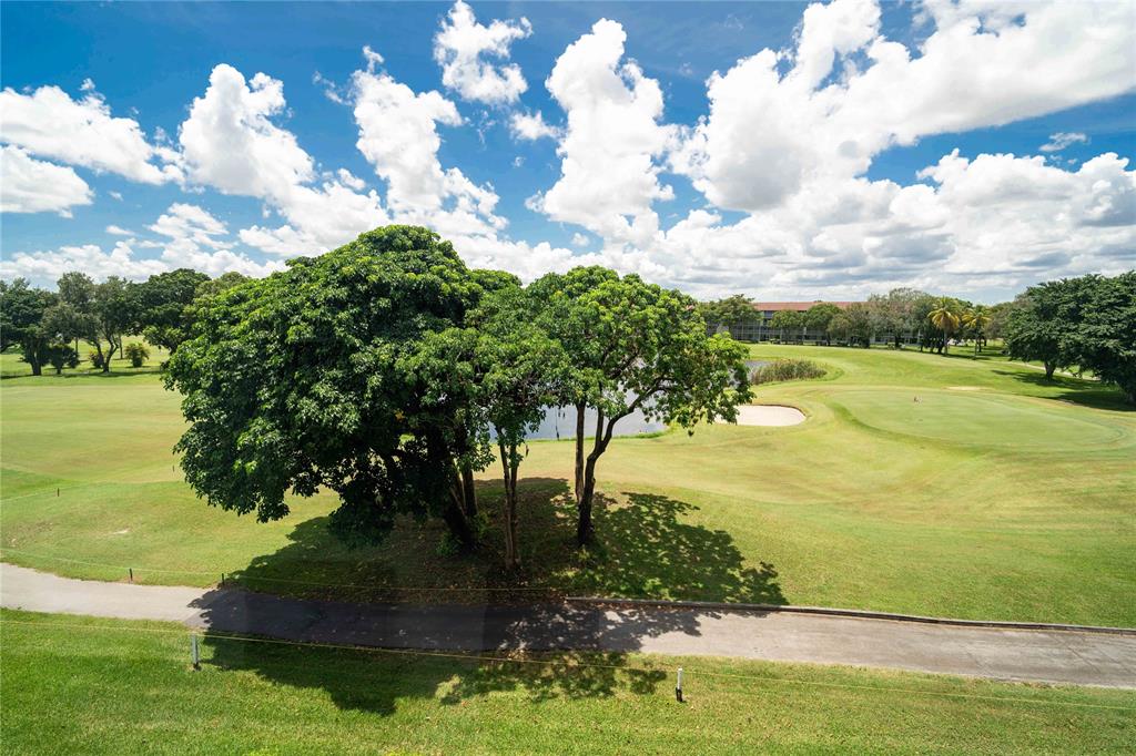 300 Southwest 134th Way, Unit 402E Pembroke Pines, FL 33027 - Photo 35 of 46 a view of a lake with a big yard