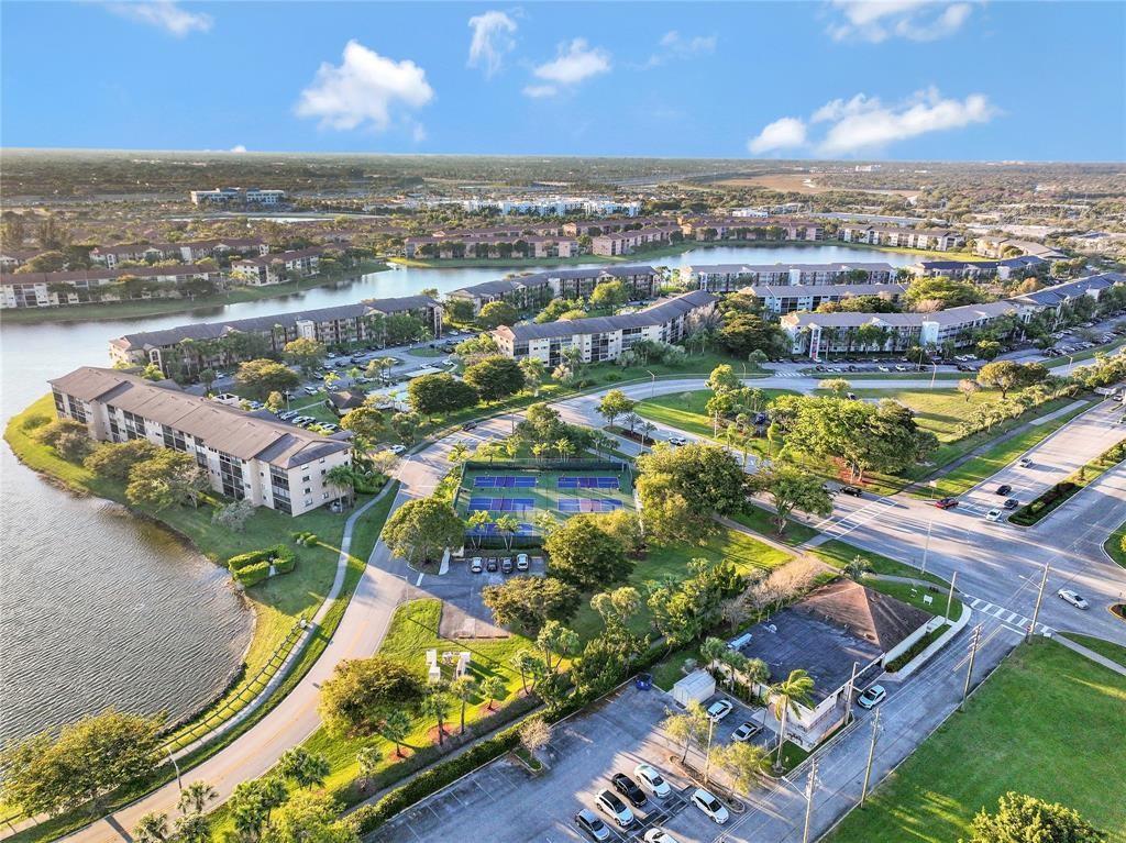 300 Southwest 134th Way, Unit 402E Pembroke Pines, FL 33027 - Photo 39 of 46 an aerial view of residential houses with outdoor space