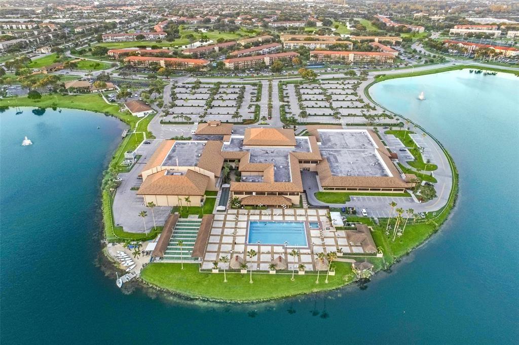 300 Southwest 134th Way, Unit 402E Pembroke Pines, FL 33027 - Photo 44 of 46 an aerial view of a house with a swimming pool yard and lake view