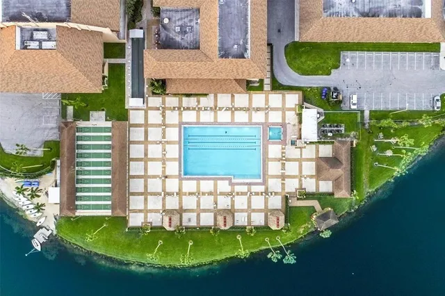 a patio with yard glass top table and chairs