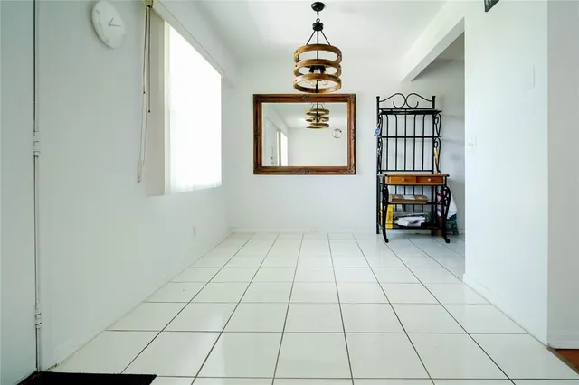 a view of hallway with wooden floor