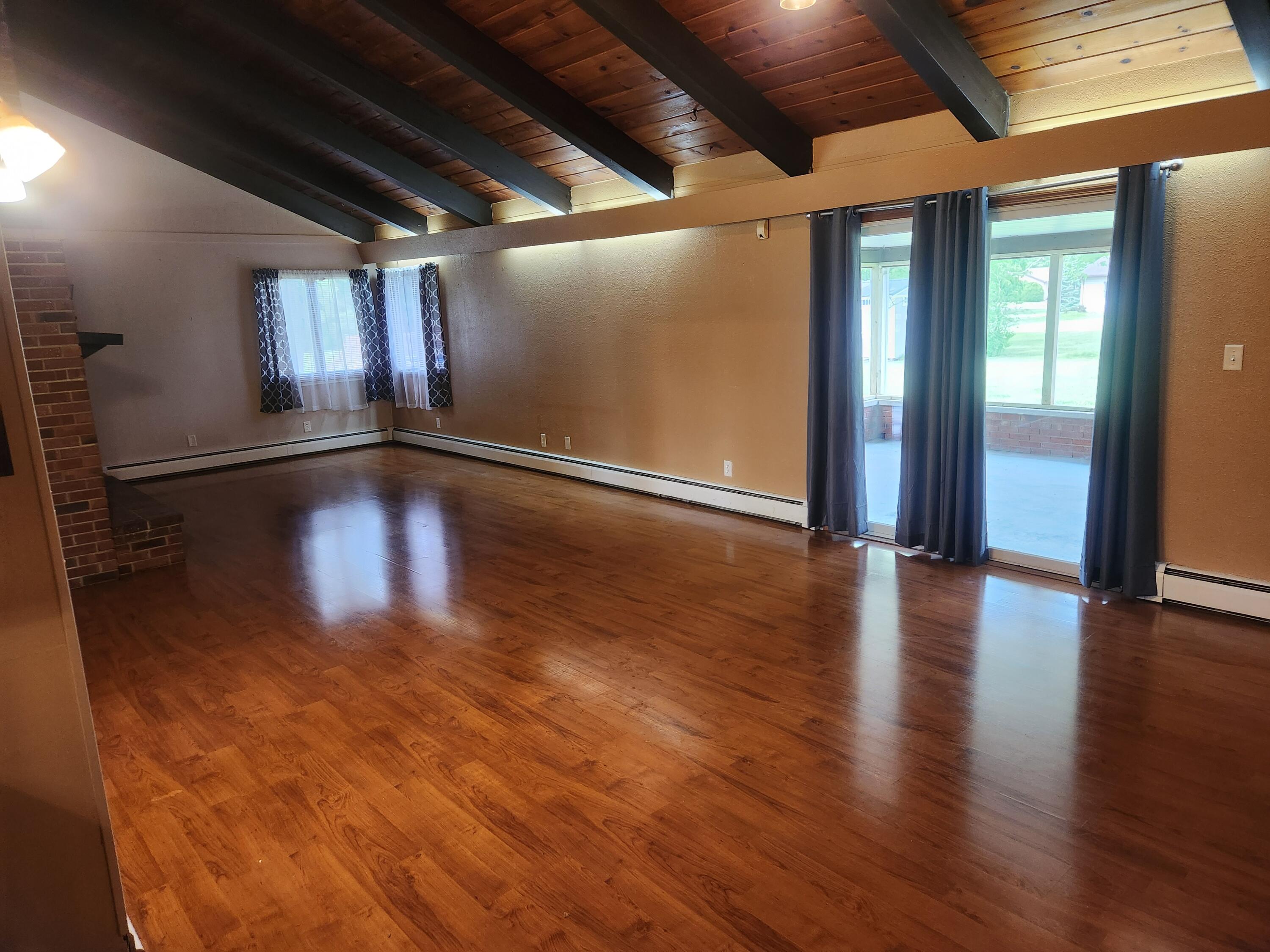 4726 Locksley Drive East Rensselaer, IN 47978 - Photo 8 of 33 a view of an empty room with wooden floor