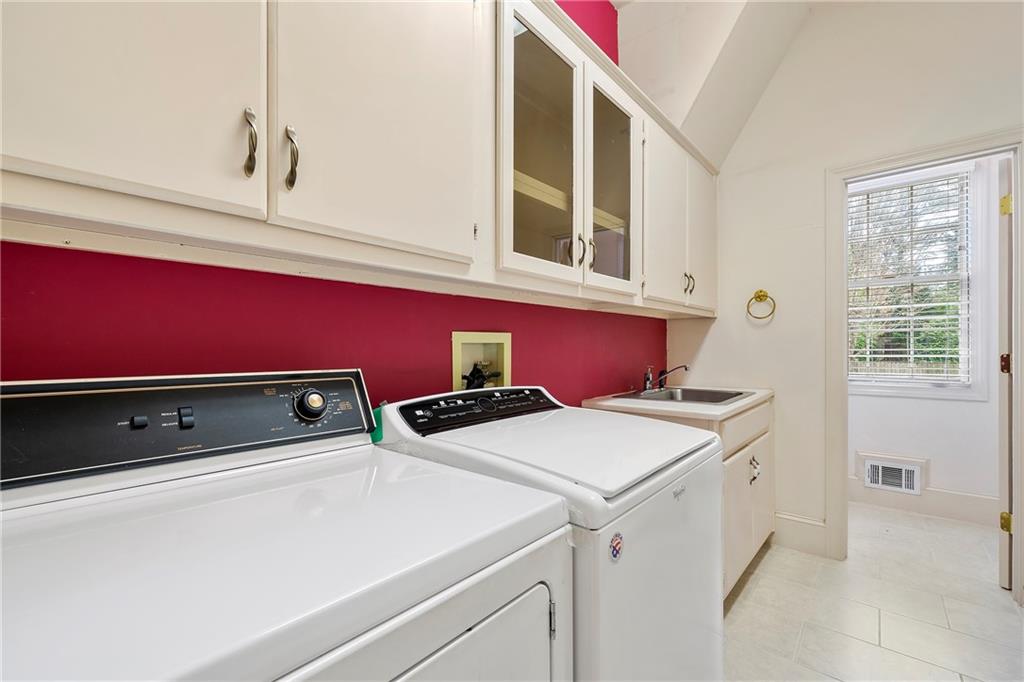 5360 Northwater Way Duluth, GA 30097 - Photo 16 of 62 a utility room with dryer and washer
