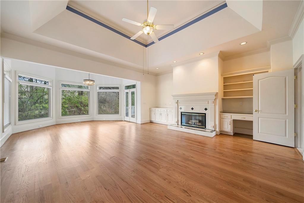 5360 Northwater Way Duluth, GA 30097 - Photo 17 of 62 a view of a livingroom with a fireplace wooden floor and window
