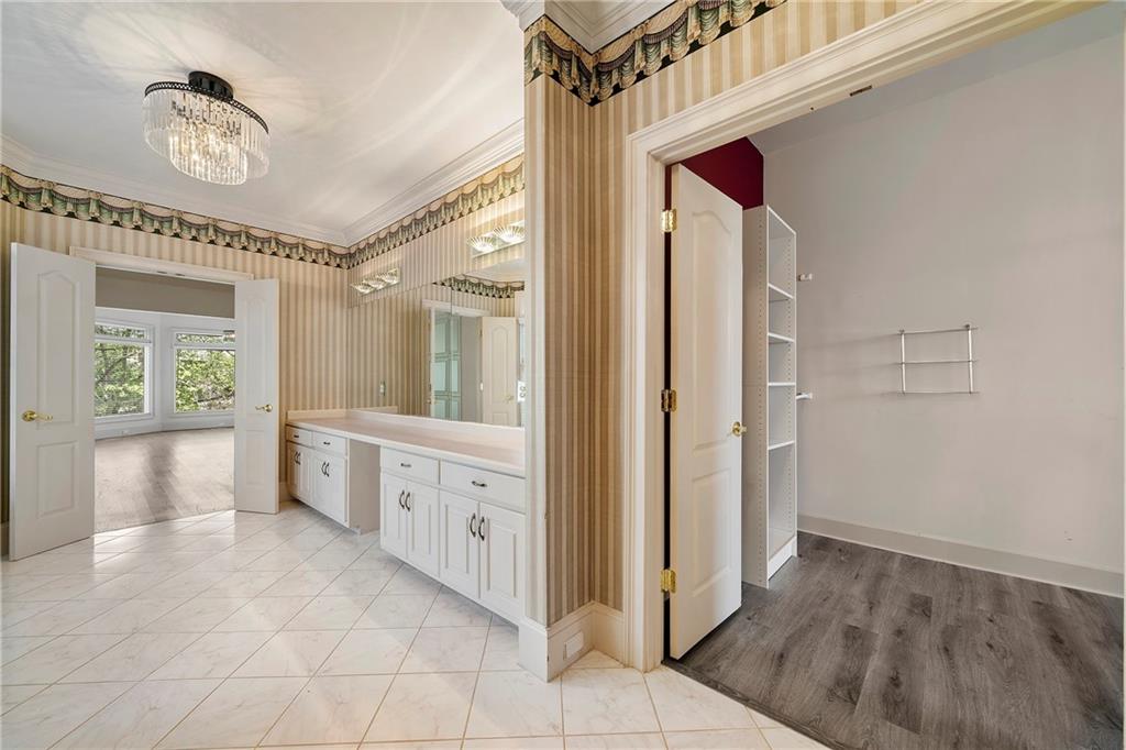 5360 Northwater Way Duluth, GA 30097 - Photo 19 of 62 a bathroom with a glass door shower a sink and a mirror