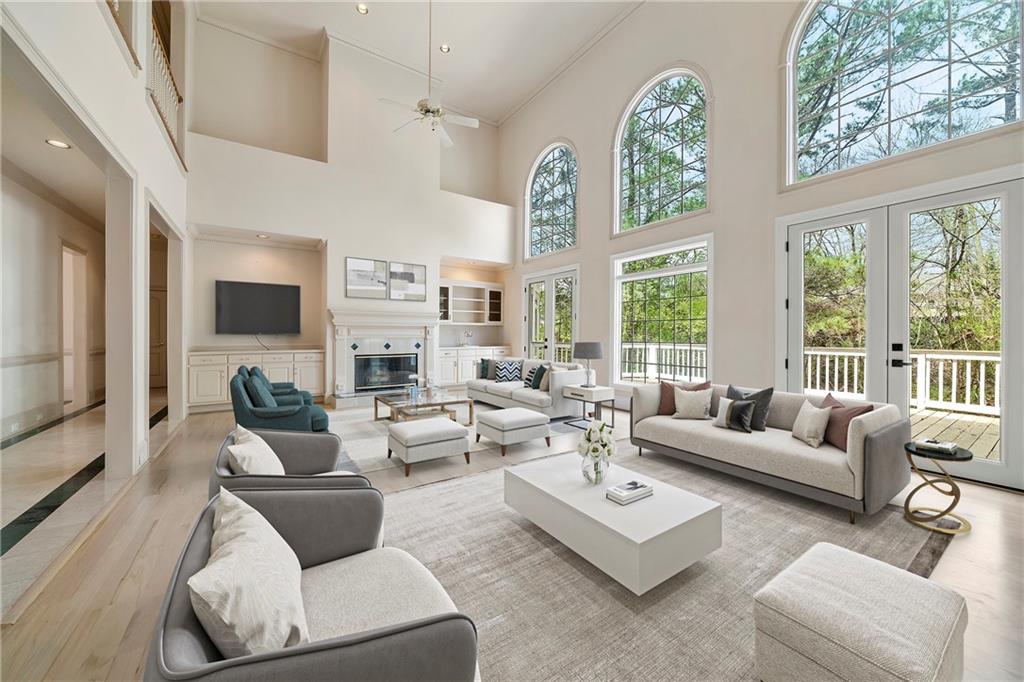 5360 Northwater Way Duluth, GA 30097 - Photo 2 of 62 a living room with furniture fireplace and a large window