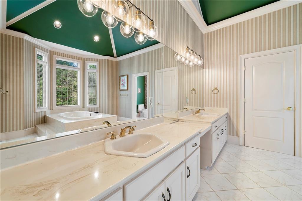 5360 Northwater Way Duluth, GA 30097 - Photo 21 of 62 a spacious bathroom with a sink and a large mirror