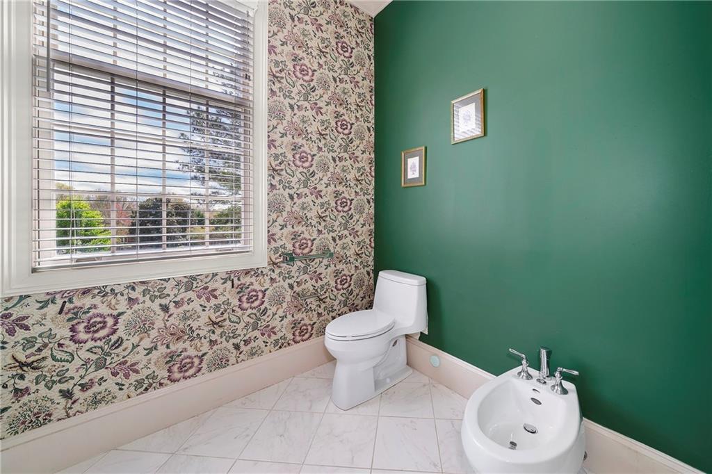 5360 Northwater Way Duluth, GA 30097 - Photo 24 of 62 a bathroom with a toilet sink and mirror
