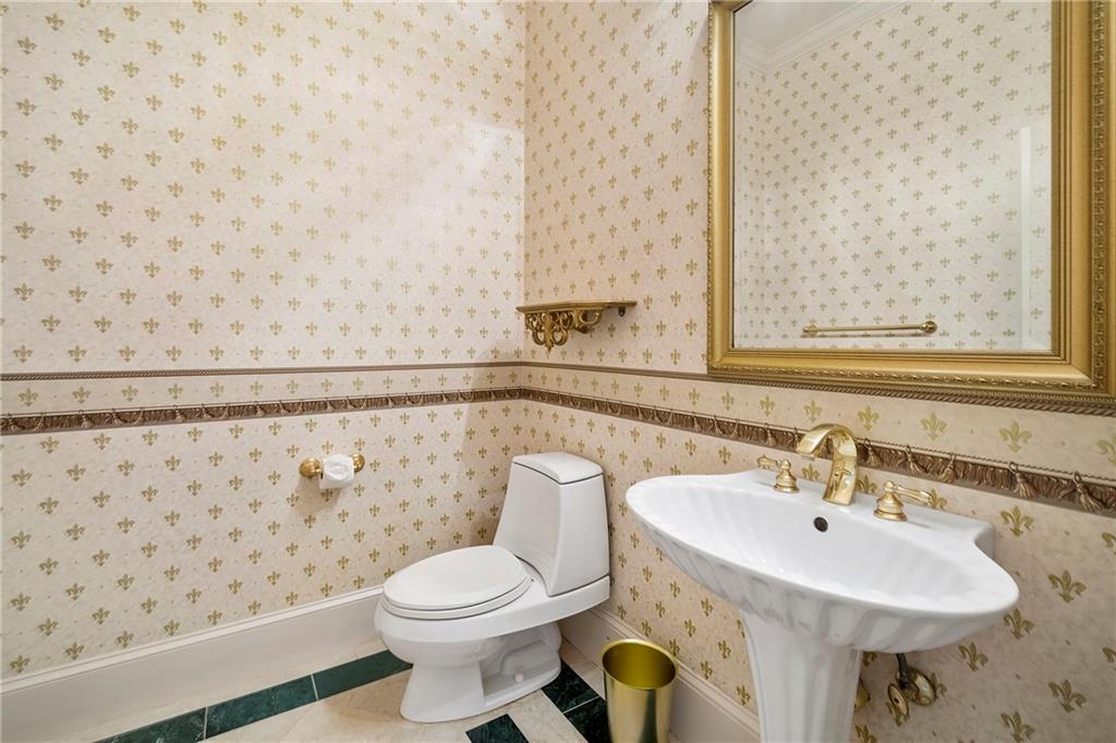 5360 Northwater Way Duluth, GA 30097 - Photo 27 of 62 a bathroom with a sink and a toilet