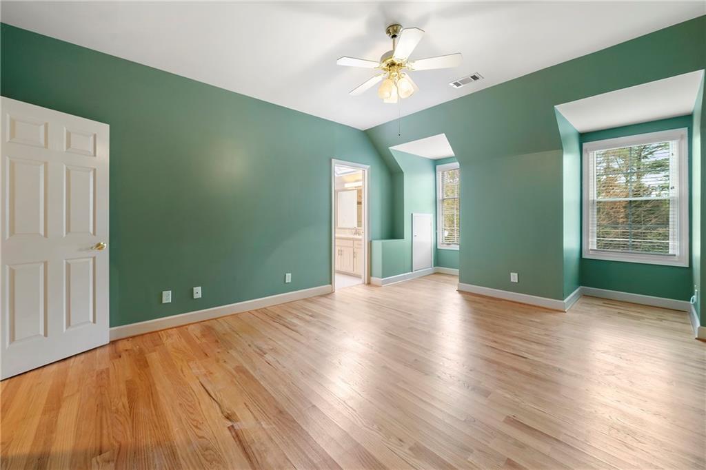 5360 Northwater Way Duluth, GA 30097 - Photo 28 of 62 a view of an empty room with window and wooden floor