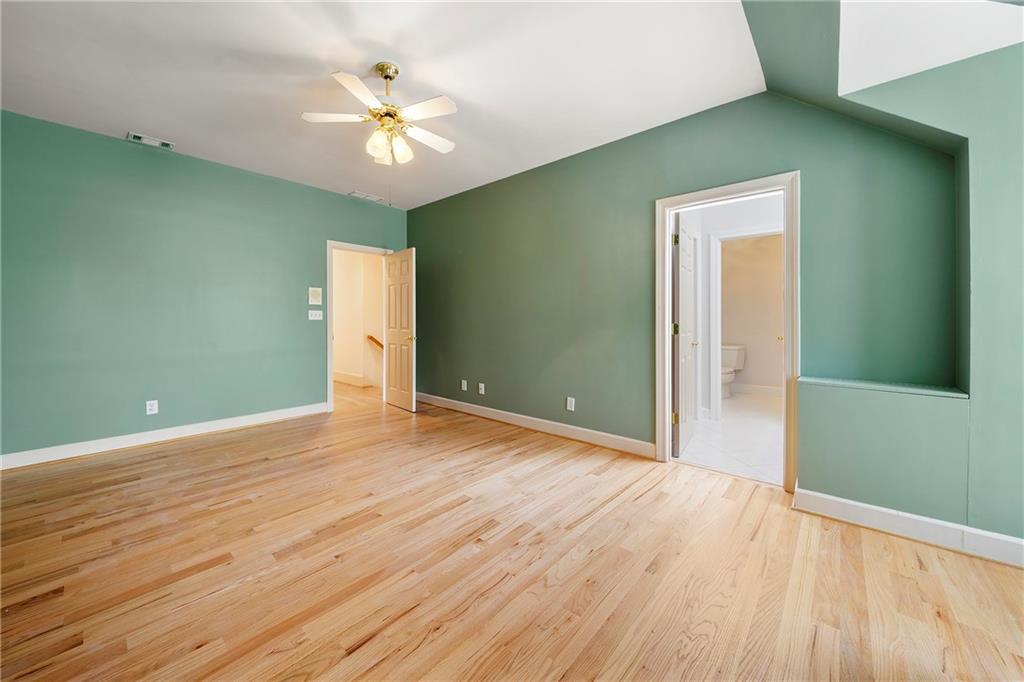 5360 Northwater Way Duluth, GA 30097 - Photo 29 of 62 wooden floor in an empty room with a window