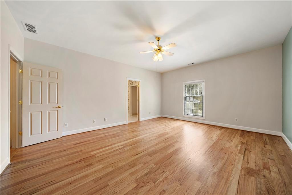 5360 Northwater Way Duluth, GA 30097 - Photo 32 of 62 an empty room with wooden floor and windows