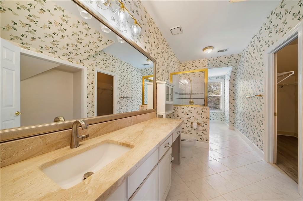 5360 Northwater Way Duluth, GA 30097 - Photo 33 of 62 a bathroom with a sink and a mirror