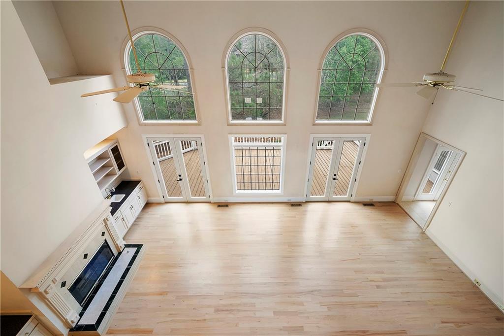 5360 Northwater Way Duluth, GA 30097 - Photo 34 of 62 wooden floor in an empty room with windows