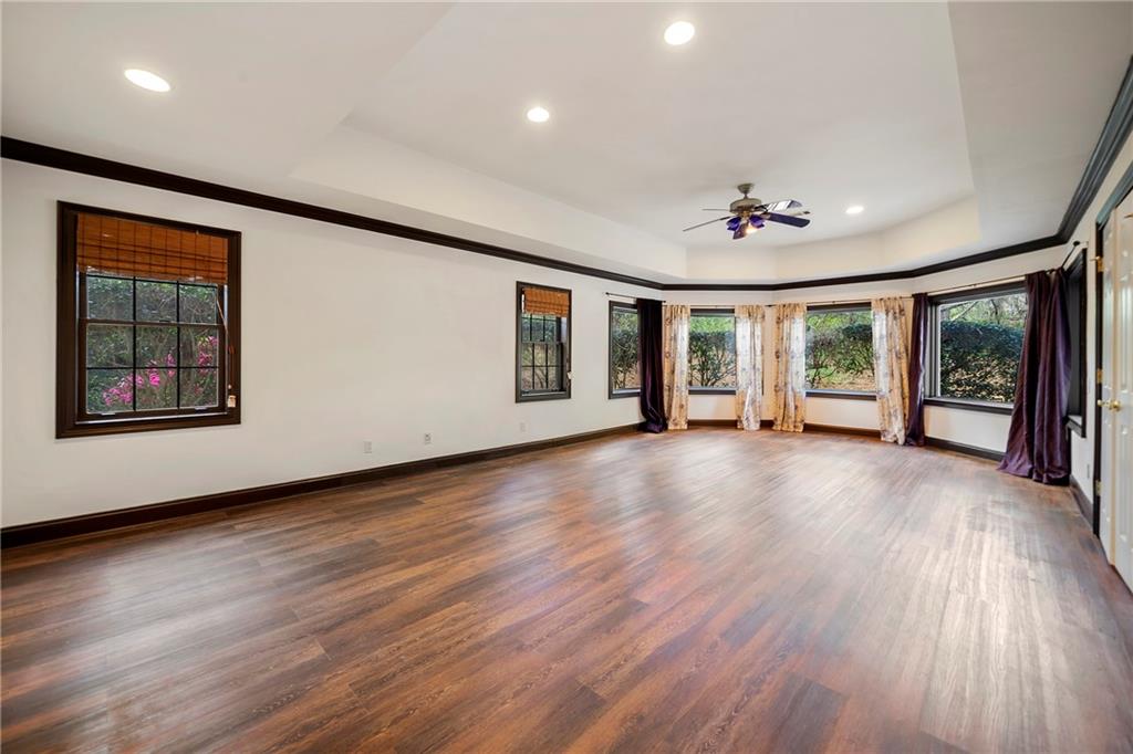 5360 Northwater Way Duluth, GA 30097 - Photo 42 of 62 a view of an empty room with a window and wooden floor