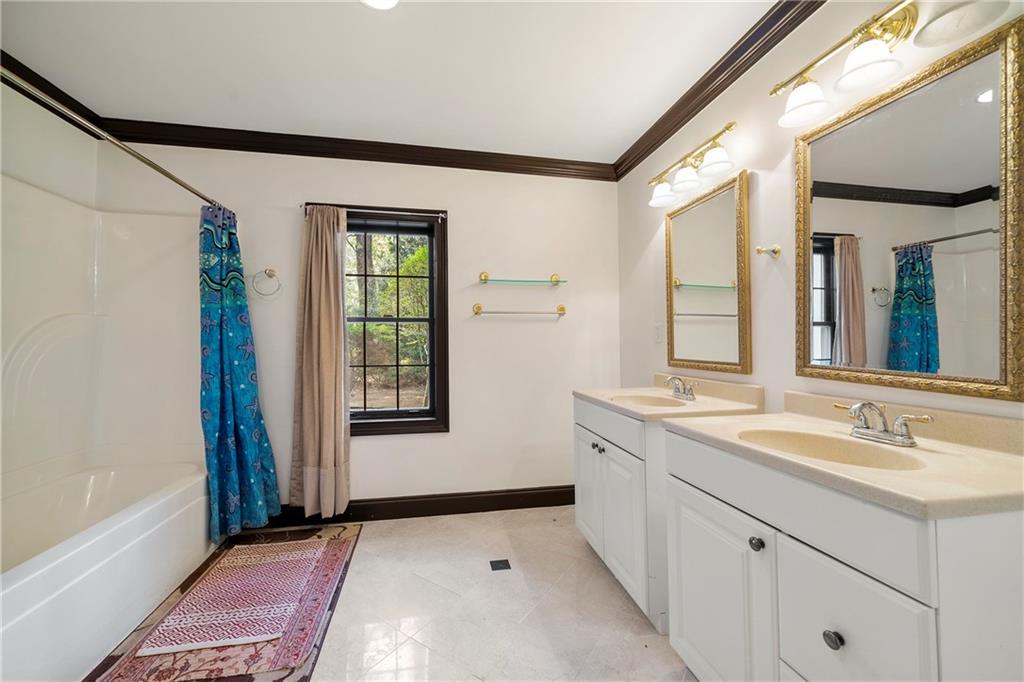 5360 Northwater Way Duluth, GA 30097 - Photo 44 of 62 a bathroom with a sink and a mirror
