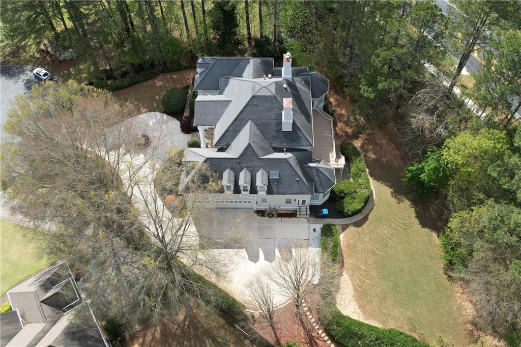 5360 Northwater Way Duluth, GA 30097 - Photo 58 of 62 an aerial view of a house with swimming pool and large trees