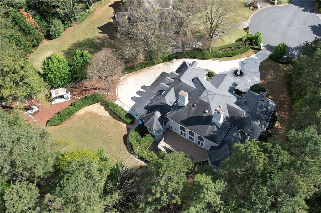 5360 Northwater Way Duluth, GA 30097 - Photo 61 of 62 an aerial view of a house with a yard and trees