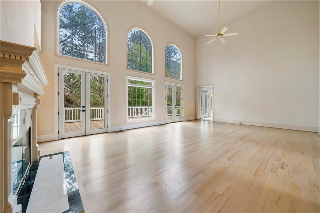 5360 Northwater Way Duluth, GA 30097 - Photo 10 of 62 an empty room with wooden floor and windows