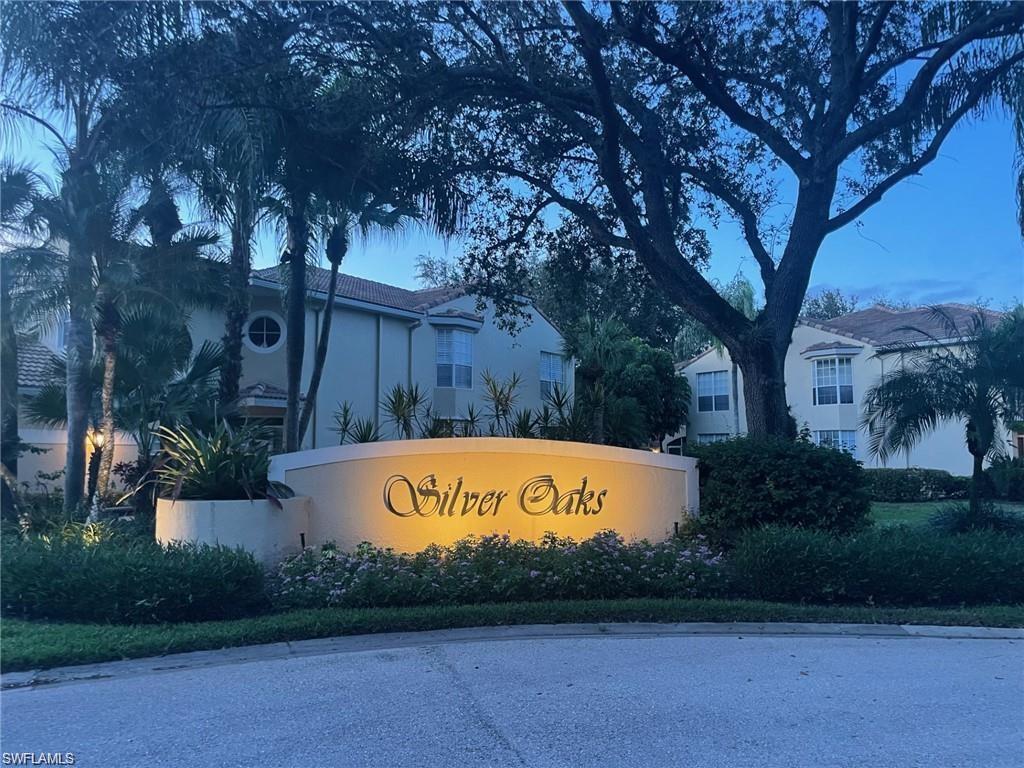 56 Silver Oaks Circle, Unit 102 Naples, FL 34119 - Photo 7 of 12 View of community sign