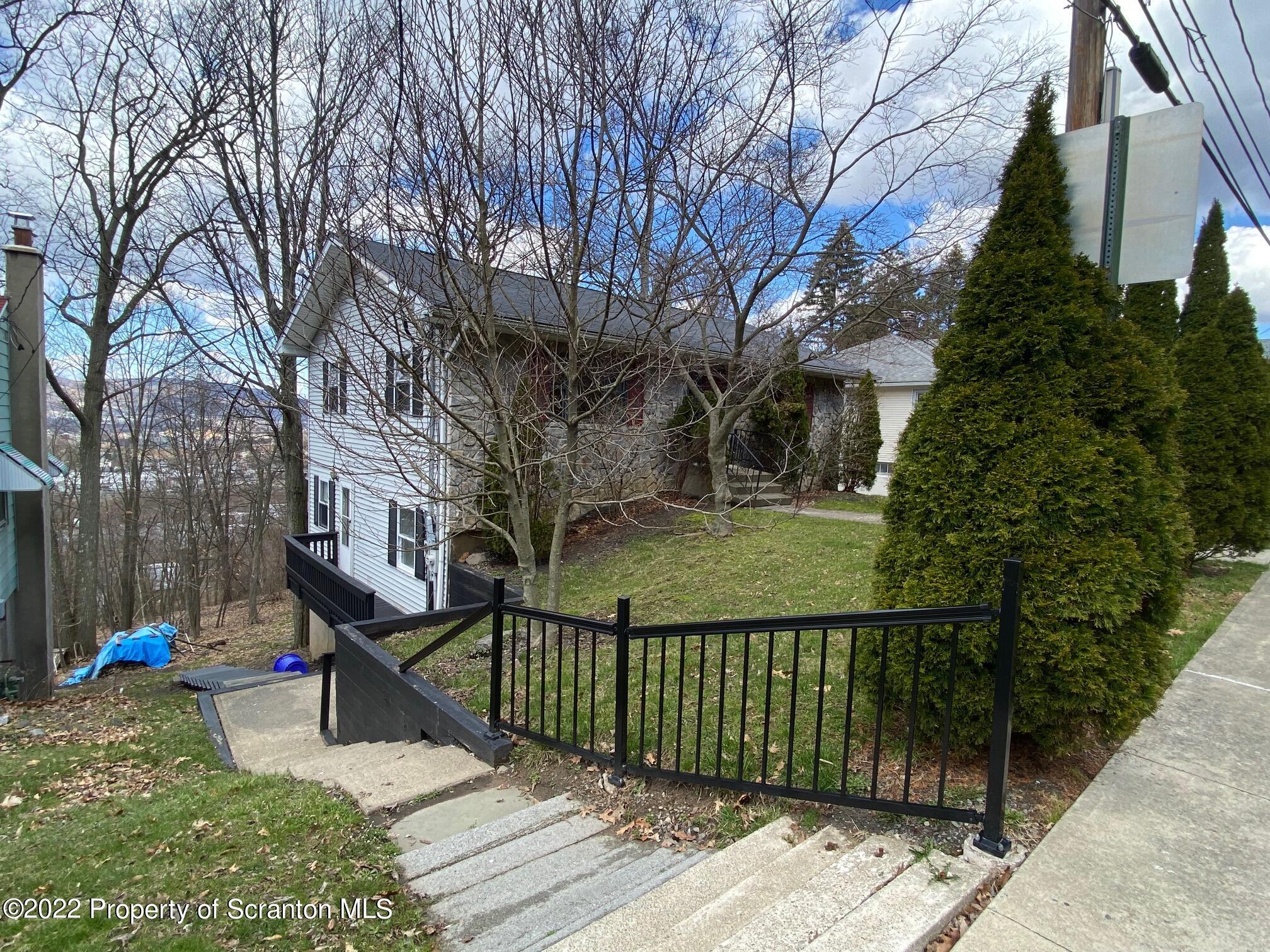 23 East Mountain Road Scranton, PA 18505 - Photo 3 of 26 a view of a street with a tree in front of it