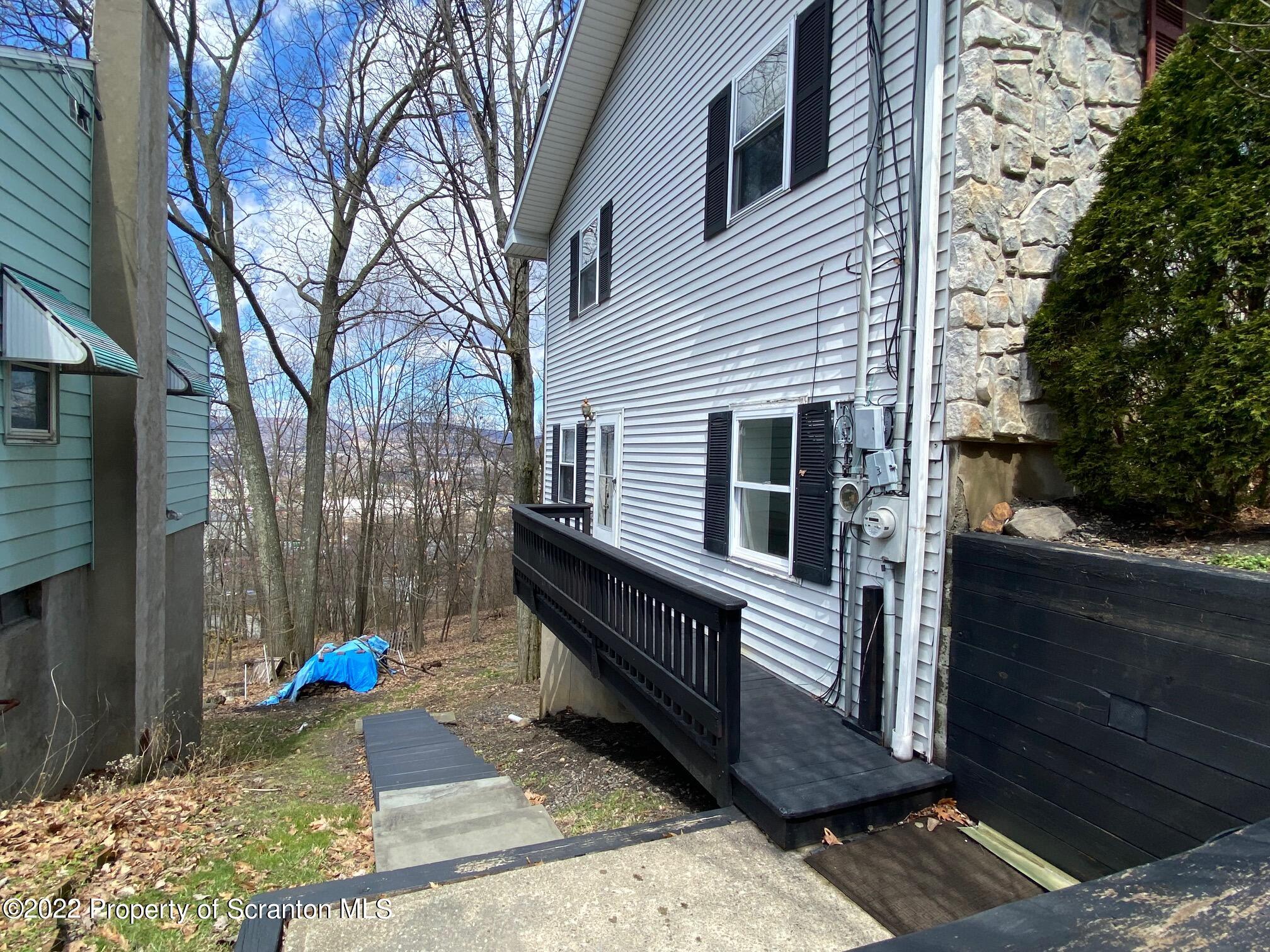 23 East Mountain Road Scranton, PA 18505 - Photo 6 of 26 a view of a two chairs in the back yard