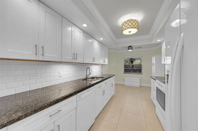 a bathroom with a sink mirror toilet and shower