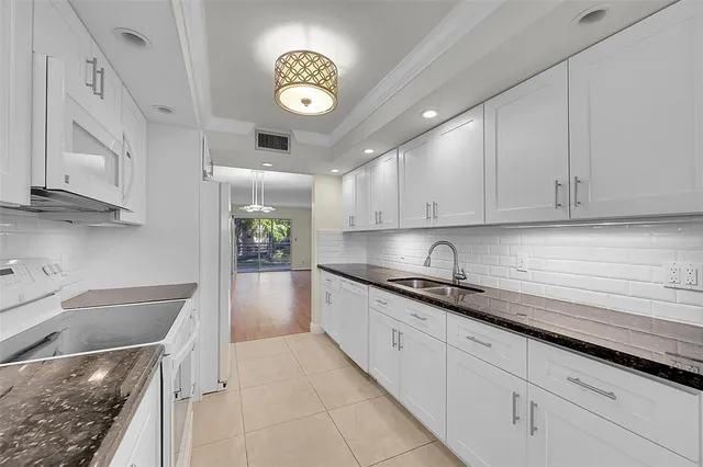 a bathroom with a toilet and a shower curtain
