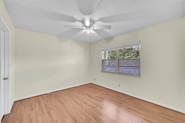 a bed room with a bed and a chair