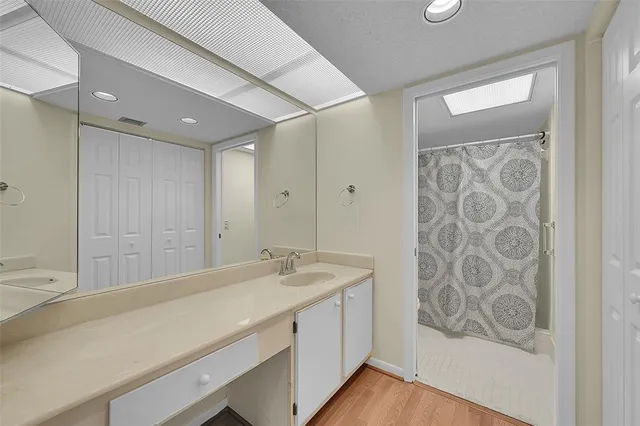 a view of room with window and wooden floor