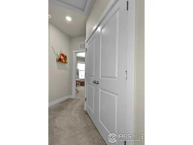 a view of a hallway with closet