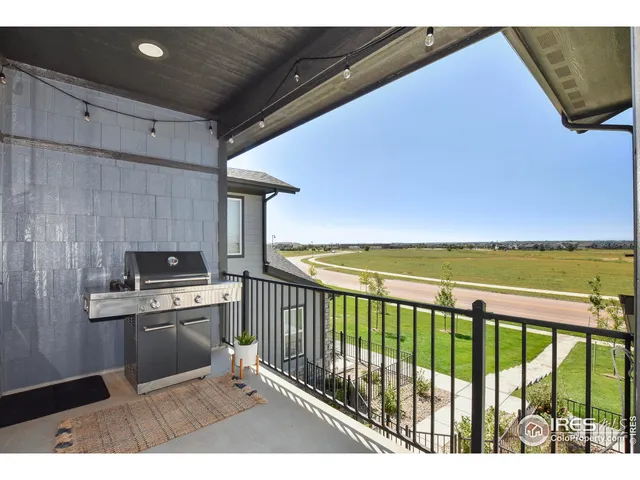 a kitchen with a stove a sink and cabinets