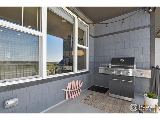a kitchen with a stove a refrigerator and a microwave