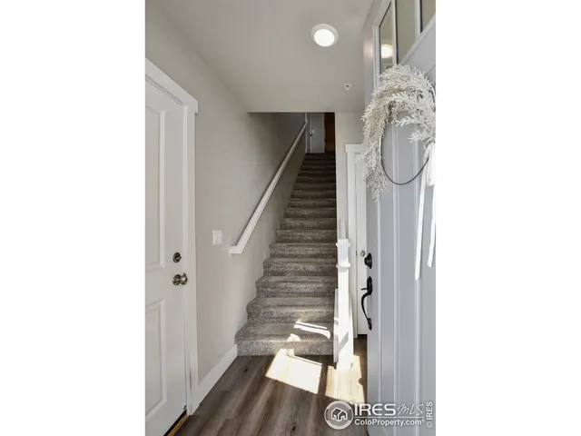 a view of entryway with wooden floor
