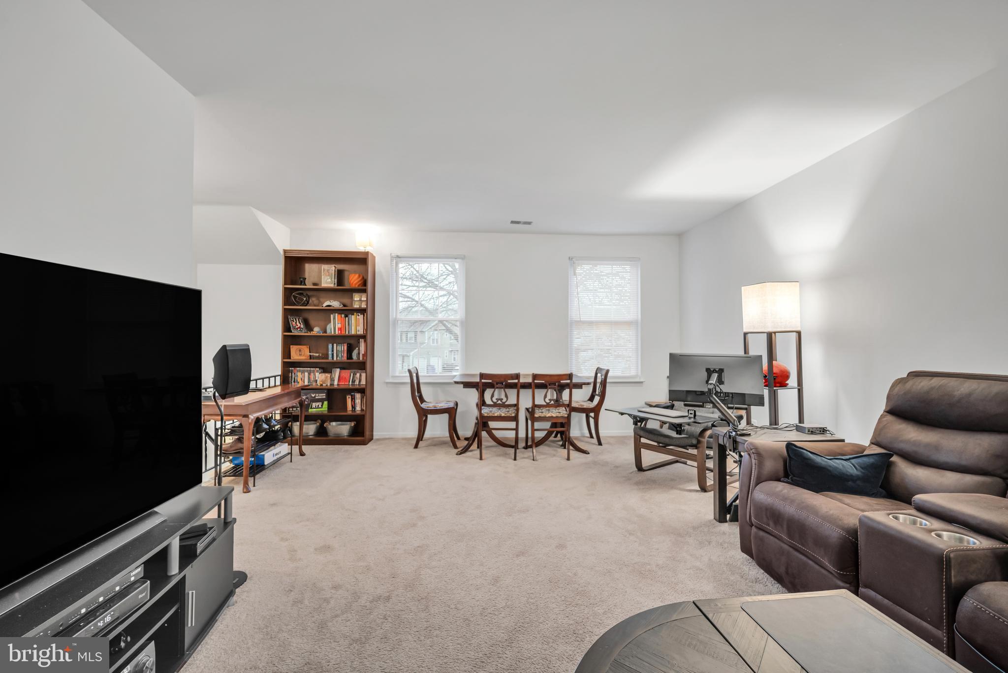 604 Wrensong Road Yardley, PA 19067 - Photo 11 of 37 a living room with furniture and a flat screen tv
