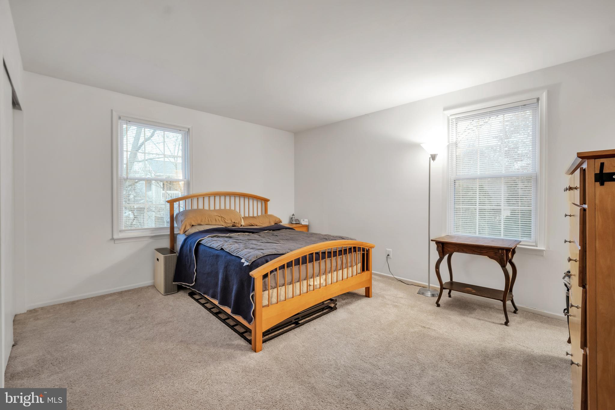 604 Wrensong Road Yardley, PA 19067 - Photo 17 of 37 a bedroom with a bed and a table in it