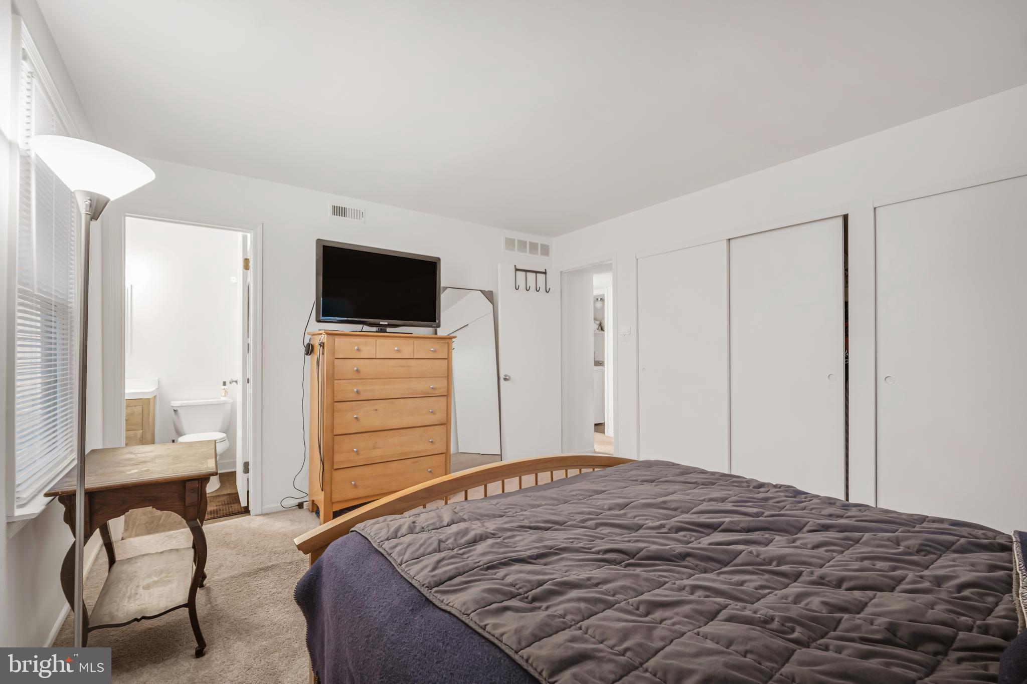 604 Wrensong Road Yardley, PA 19067 - Photo 18 of 37 a bedroom with a bed and chair