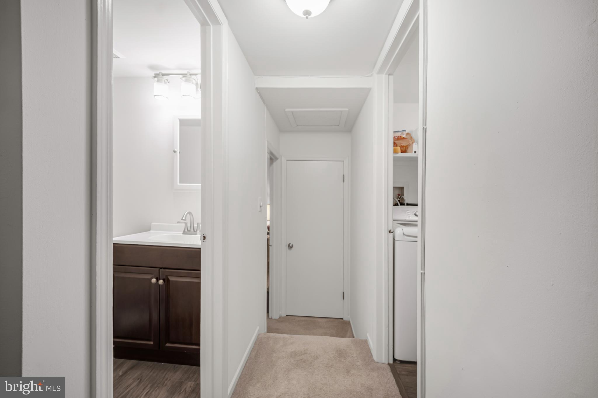 604 Wrensong Road Yardley, PA 19067 - Photo 21 of 37 a view of a bathroom from a hallway