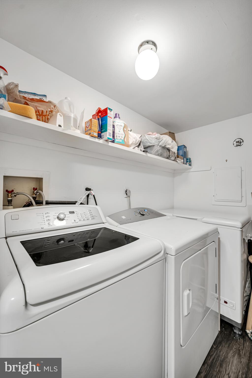 604 Wrensong Road Yardley, PA 19067 - Photo 23 of 37 a view of cabinets with washer and dryer